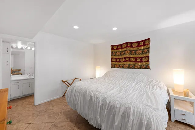 a bedroom with a bed and a cabinets