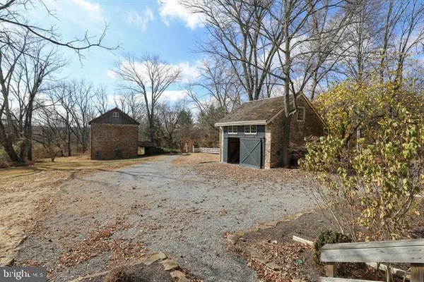 a view of house with outdoor space and trees