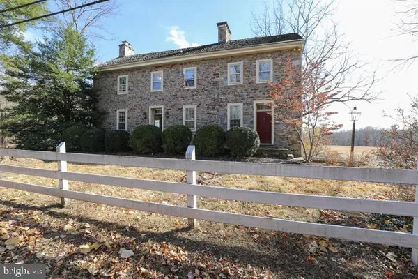 a view of large house with a yard