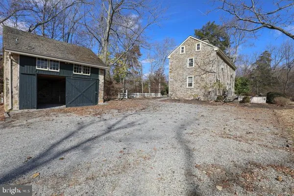 a view of a house with a snow in the yard
