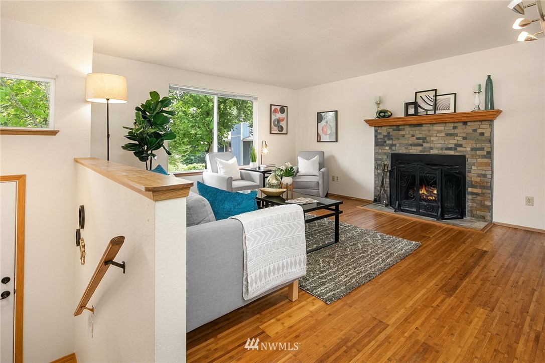 23818 1st Avenue West Bothell, WA 98021 - Photo 2 of 20 a living room with furniture and a fireplace