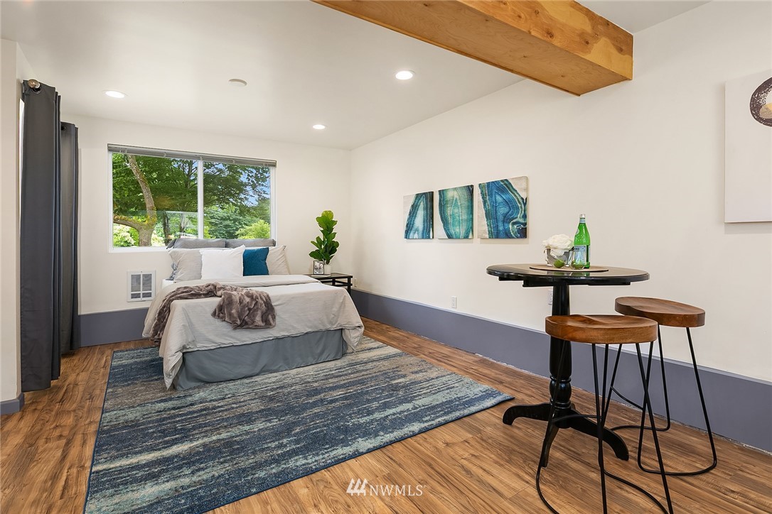 23818 1st Avenue West Bothell, WA 98021 - Photo 12 of 20 a bedroom with a bed and a window
