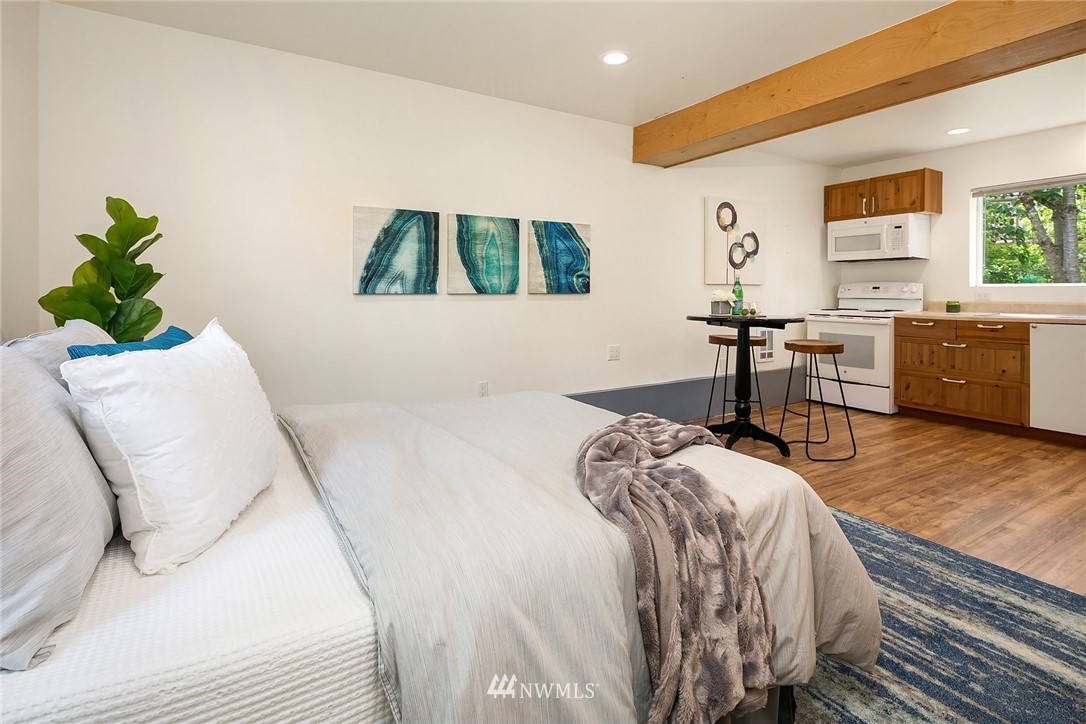 23818 1st Avenue West Bothell, WA 98021 - Photo 13 of 20 a bedroom with a bed and a chair