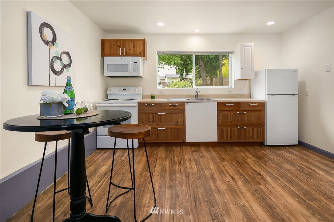 23818 1st Avenue West Bothell, WA 98021 - Photo 14 of 20 a kitchen with a table and chairs in it