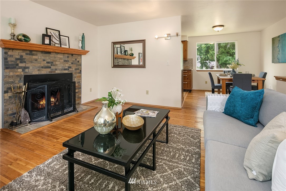 23818 1st Avenue West Bothell, WA 98021 - Photo 4 of 20 a living room with furniture and a fireplace
