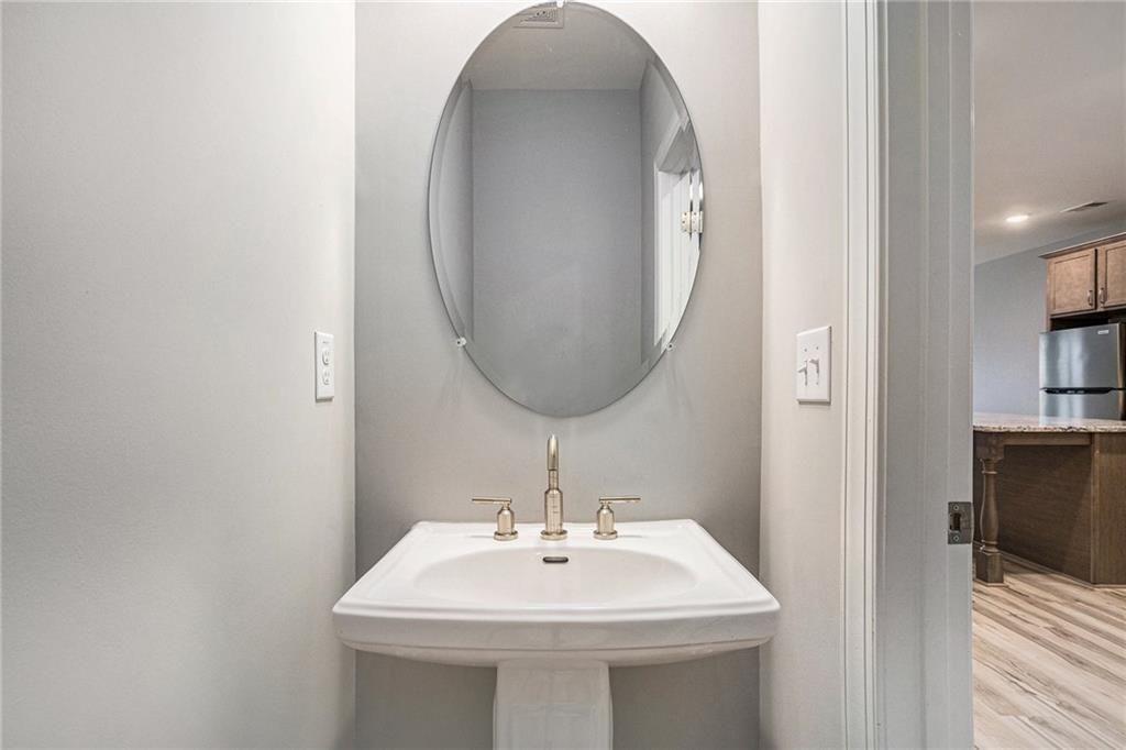1341 Parc Bench Road Atlanta, GA 30316 - Photo 12 of 28 a bathroom with a sink and a mirror