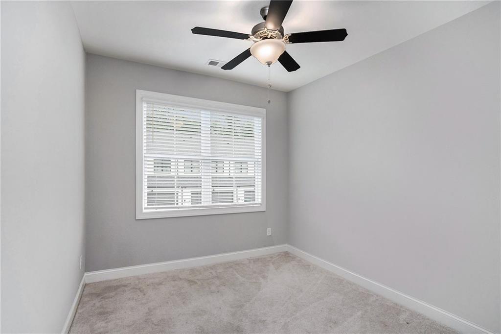 1341 Parc Bench Road Atlanta, GA 30316 - Photo 19 of 28 an empty room with a window and a fan