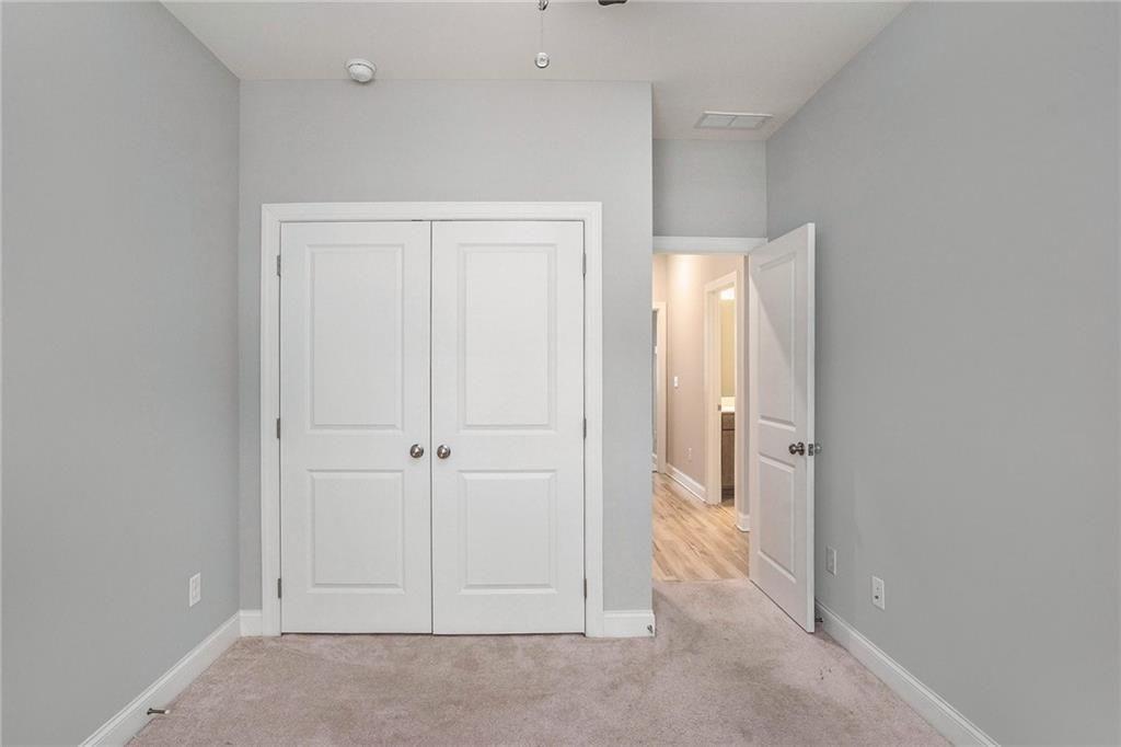 1341 Parc Bench Road Atlanta, GA 30316 - Photo 20 of 28 an empty room with windows and closet