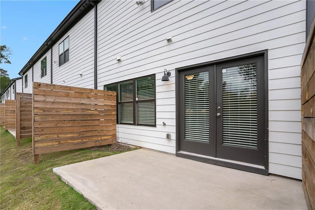 1341 Parc Bench Road Atlanta, GA 30316 - Photo 23 of 28 a view of a house with a yard and garage