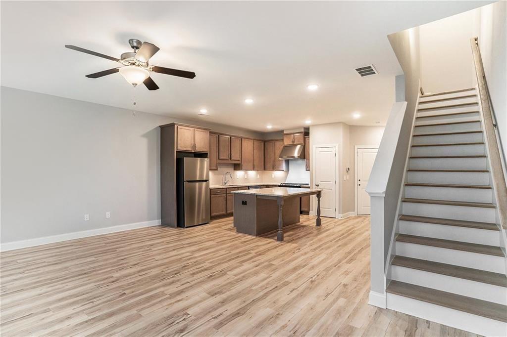 1341 Parc Bench Road Atlanta, GA 30316 - Photo 6 of 28 a open kitchen with a refrigerator and wooden floor