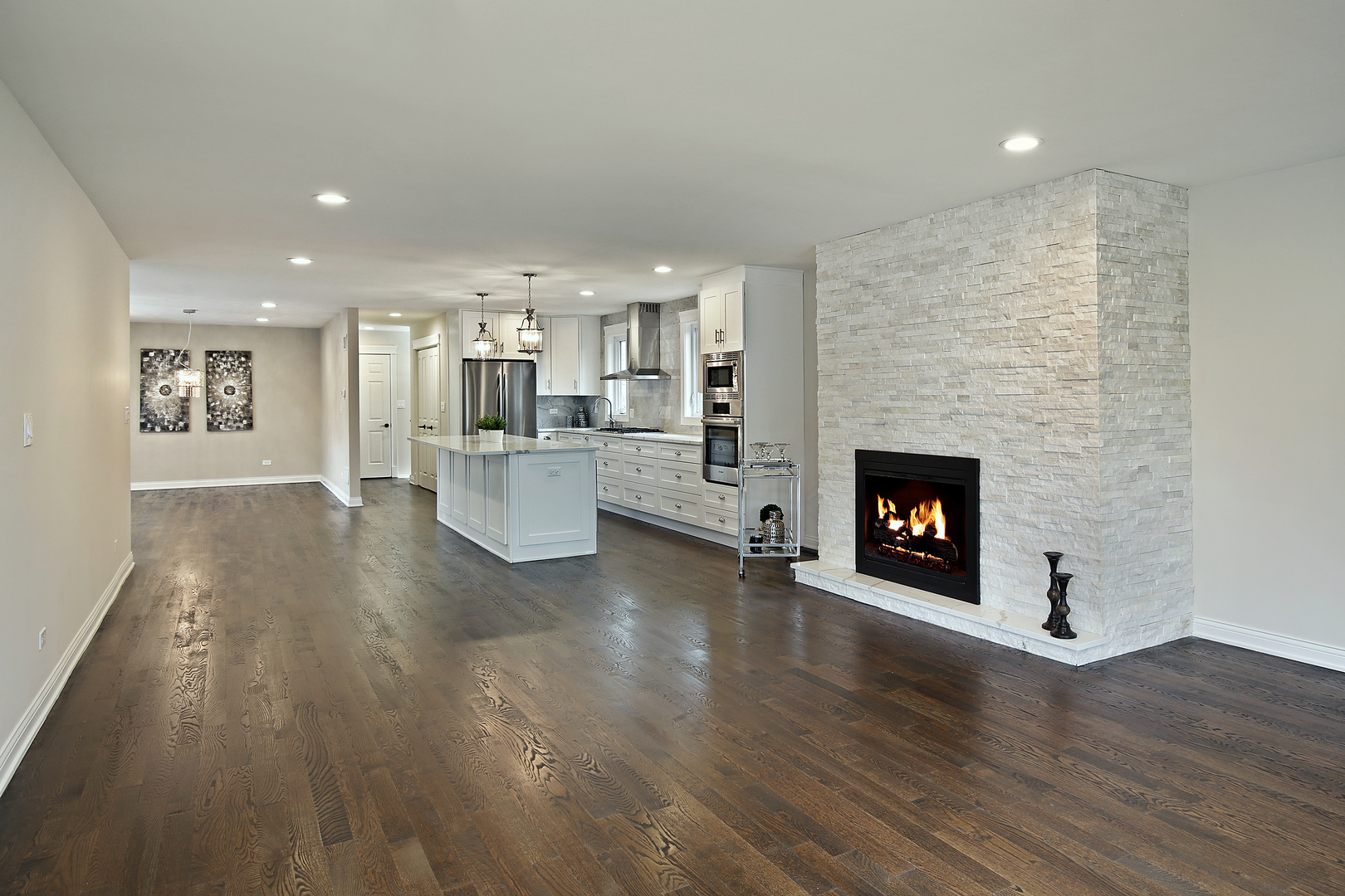 296 Ridge Road Highland Park, IL 60035 - Photo 7 of 20 a living room with stainless steel appliances furniture a fireplace and wooden floor