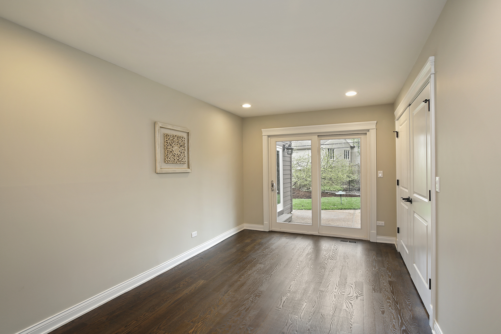 296 Ridge Road Highland Park, IL 60035 - Photo 8 of 20 a view of an empty room with wooden floor and a window