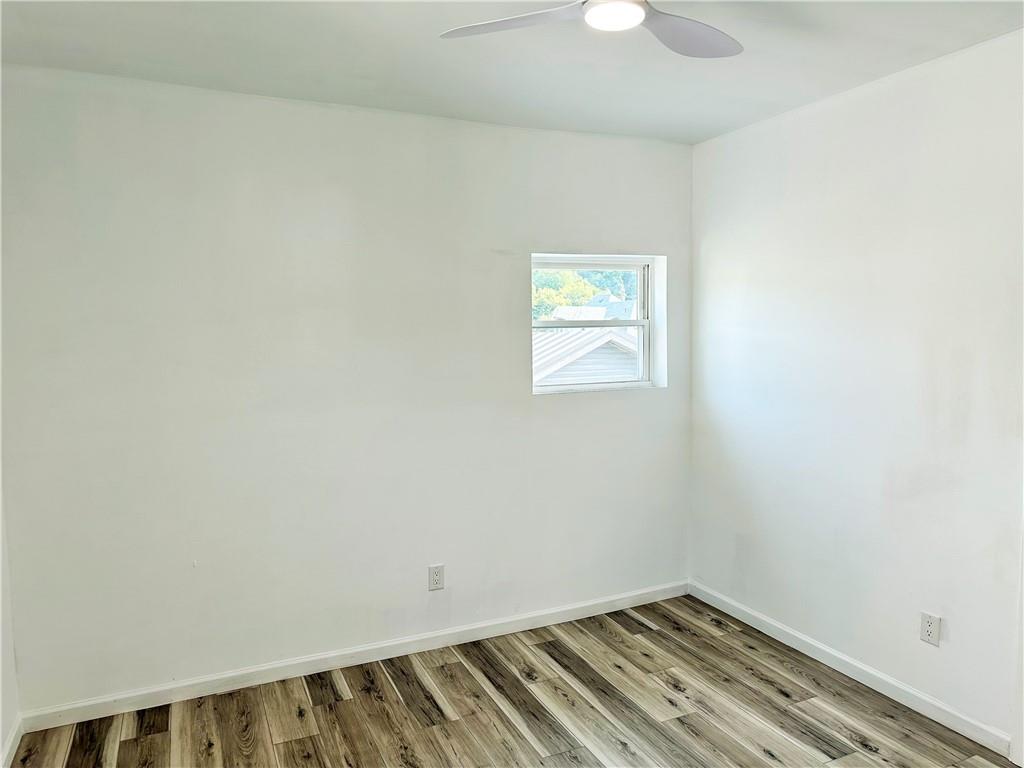 308 West Cherry Street New Castle, PA 16102 - Photo 18 of 25 a view of a room with wooden floor and fan