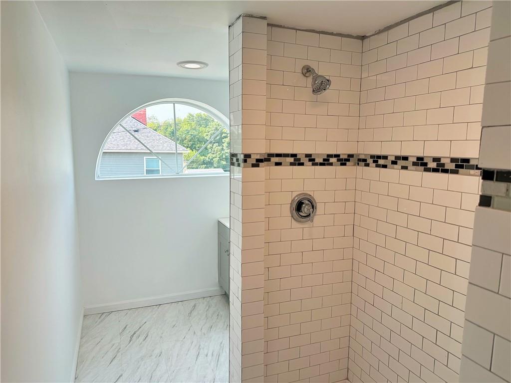 308 West Cherry Street New Castle, PA 16102 - Photo 23 of 25 a bathroom with a granite countertop shower and a window