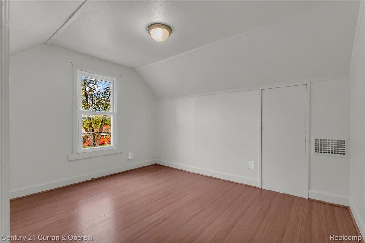 5580 South Merriman Road Wayne, MI 48184 - Photo 18 of 31 Wood-finish flooring, single window, white walls, and a flush mount ceiling light