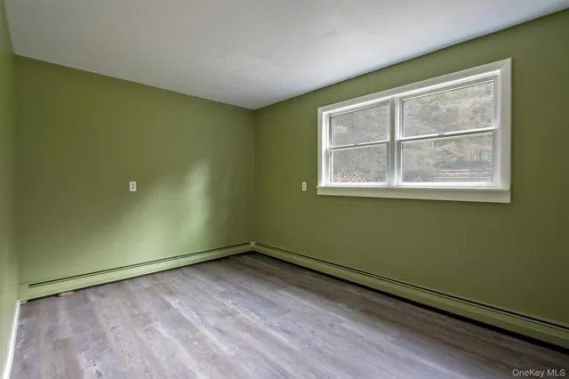 a view of a room with a large window