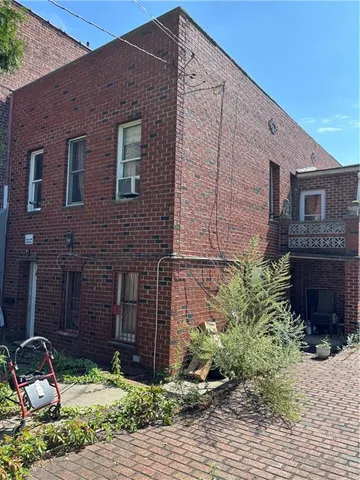 a brick building with a large windows