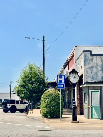 a view of a building and a street sign
