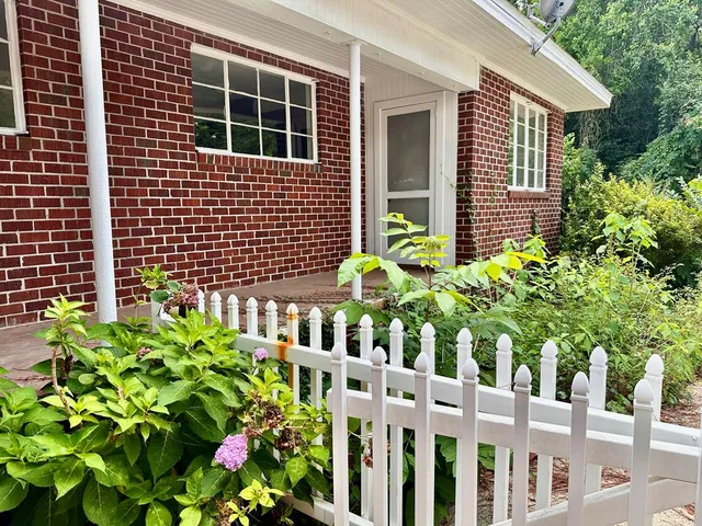 a house view with a garden space
