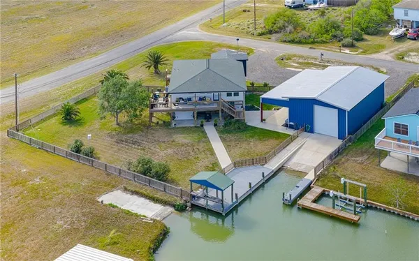 an aerial view of a house with swimming pool