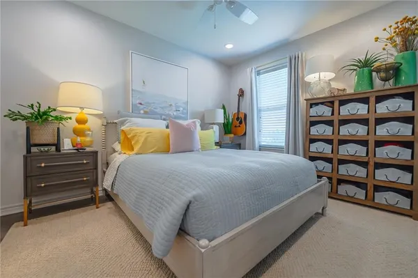 a bed room with a bed and a book shelf
