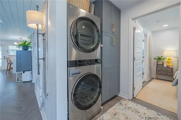 a view of a hallway with washer and dryer