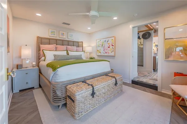 a bedroom with a bed and a couch