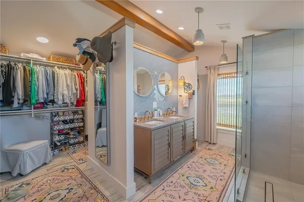 a bathroom with a sink toilet and shower