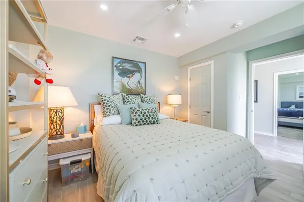 a bedroom with a bed and a table
