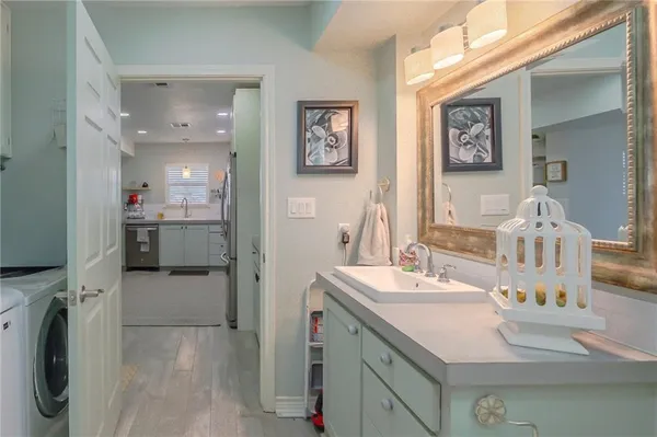 a bathroom with a sink double vanity and a mirror
