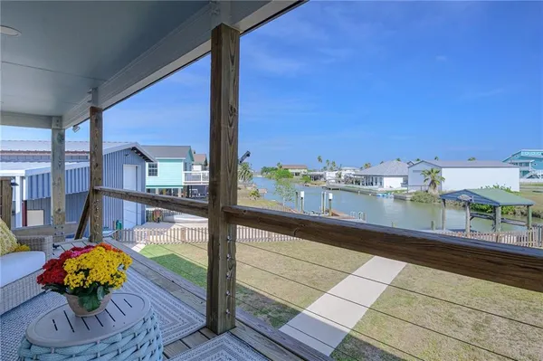 a view of a house with a yard and sitting area