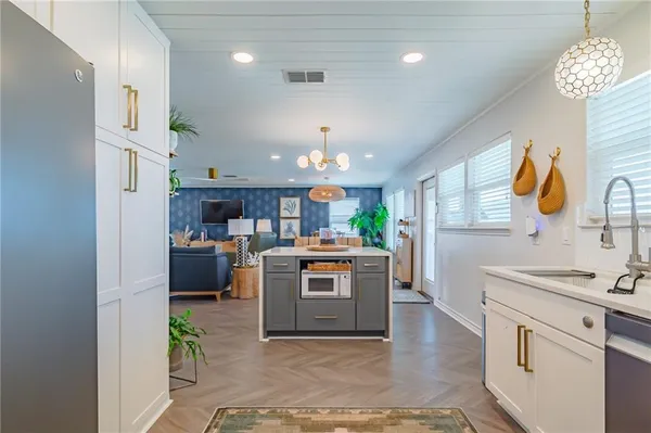 a kitchen with kitchen island granite countertop lots of counter top space