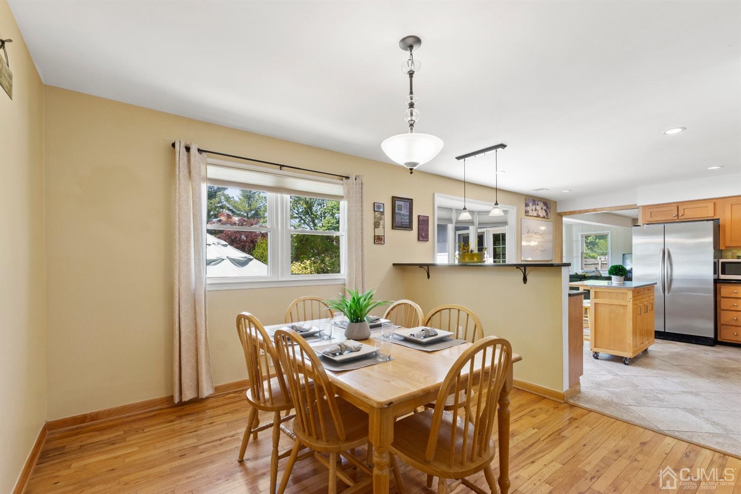 15 Tar Heels Road Hamilton, NJ 08619 - Photo 11 of 46 a view of a dining room with furniture window and wooden floor