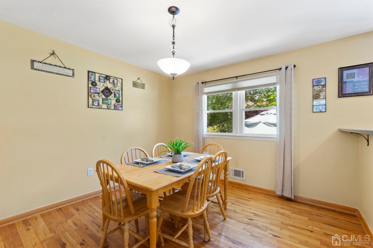 15 Tar Heels Road Hamilton, NJ 08619 - Photo 12 of 46 a view of a dining room with furniture window and wooden floor