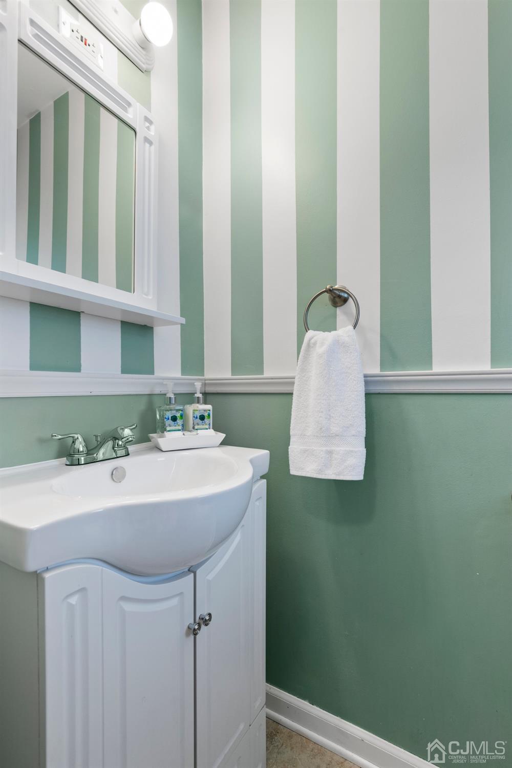 15 Tar Heels Road Hamilton, NJ 08619 - Photo 13 of 46 a bathroom with a sink and a mirror
