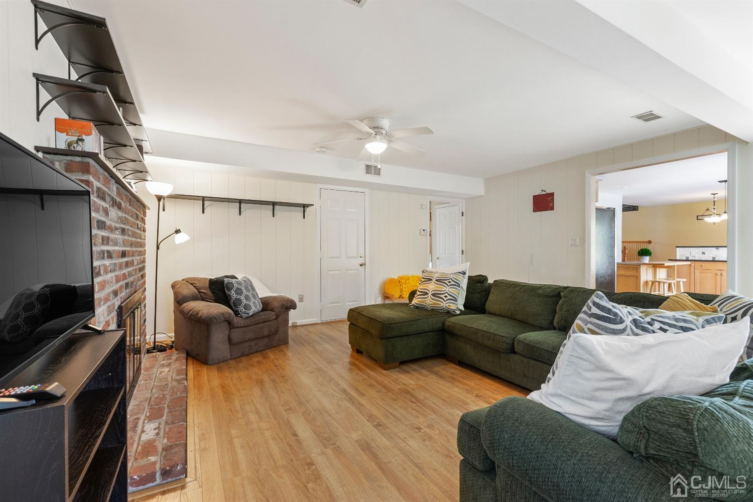 15 Tar Heels Road Hamilton, NJ 08619 - Photo 20 of 46 a living room with furniture and a flat screen tv