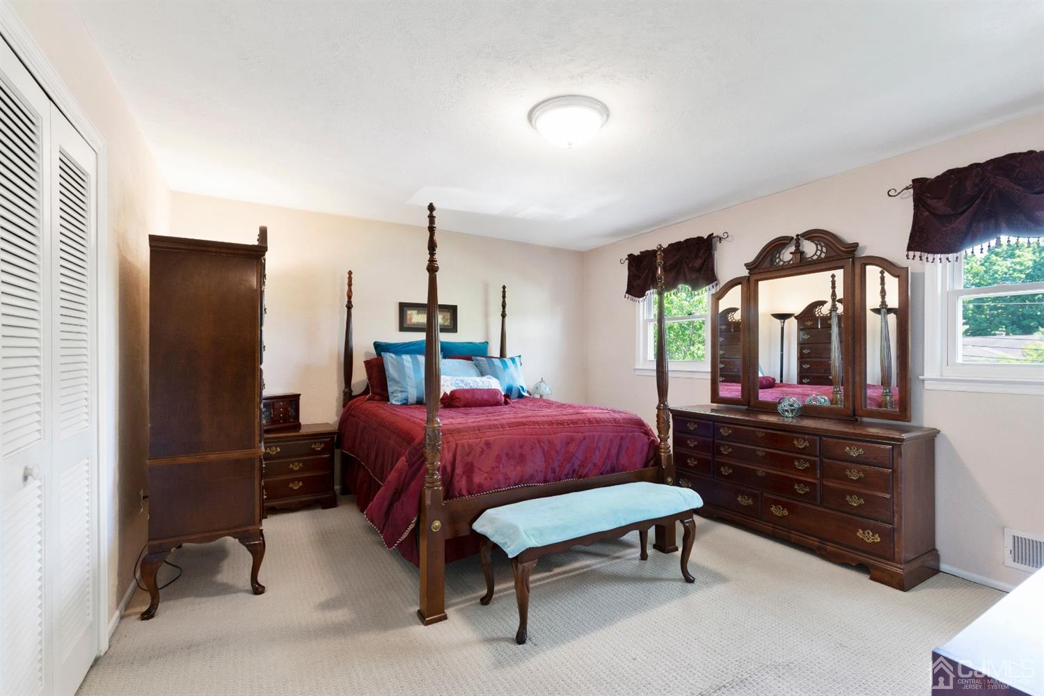 15 Tar Heels Road Hamilton, NJ 08619 - Photo 25 of 46 a bedroom with a bed mirror and window