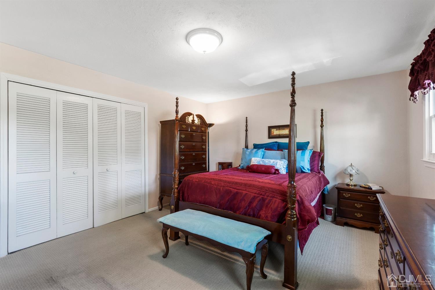 15 Tar Heels Road Hamilton, NJ 08619 - Photo 26 of 46 a bedroom with furniture and a chandelier