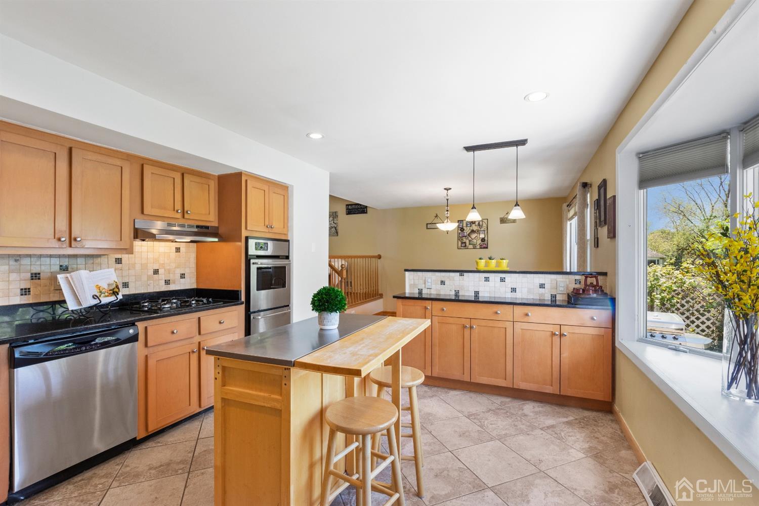 15 Tar Heels Road Hamilton, NJ 08619 - Photo 5 of 46 a kitchen with stainless steel appliances granite countertop a stove top oven a sink a counter space and cabinets