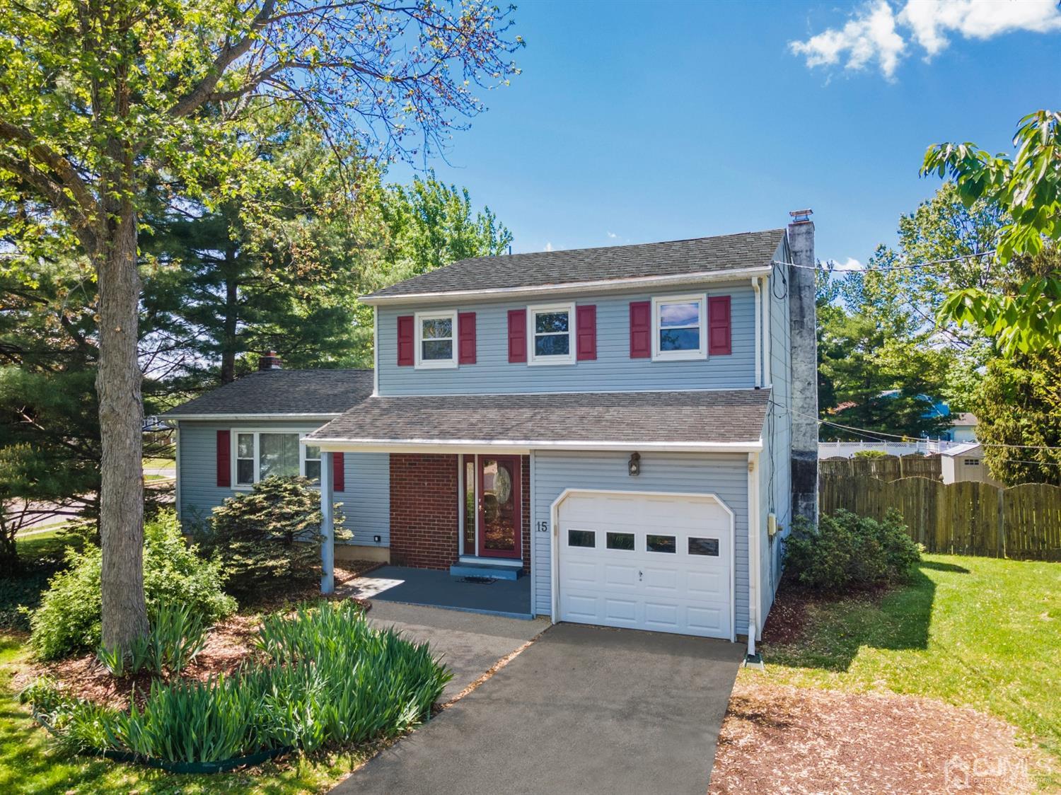 15 Tar Heels Road Hamilton, NJ 08619 - Photo 46 of 46 a front view of a house with a garden and yard