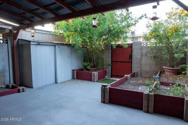 a view of a swimming pool with outdoor seating
