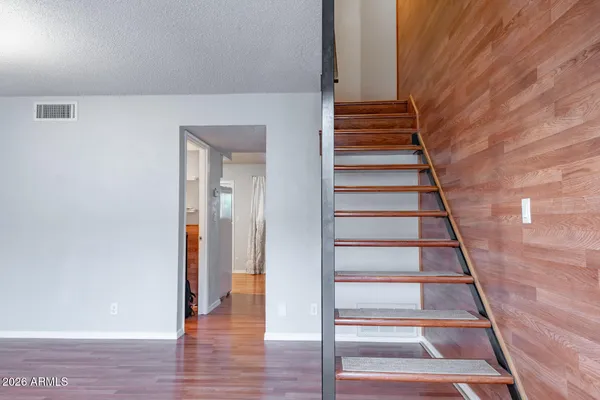 a view of entryway with wooden floor