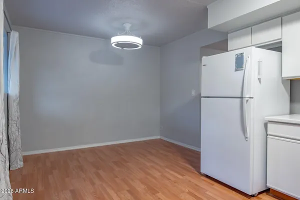 a white refrigerator freezer sitting in a kitchen