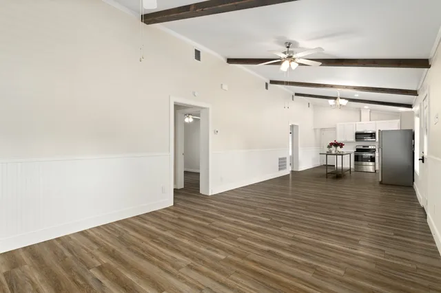 a view of a livingroom with wooden floor