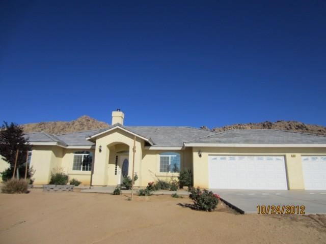 19018 Joshua Road Apple Valley, CA 92308 - Photo 1 of 1 a view of a house with a yard
