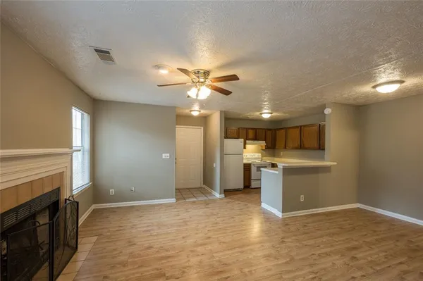 a view of a kitchen with a sink and a stove top oven