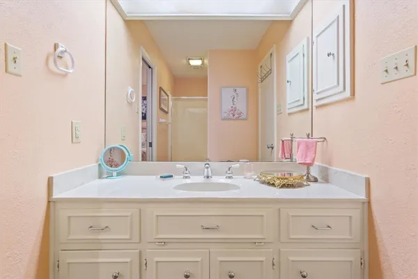 a bathroom with a sink and a mirror