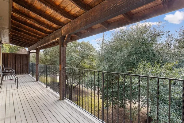 a view of balcony with wooden floor