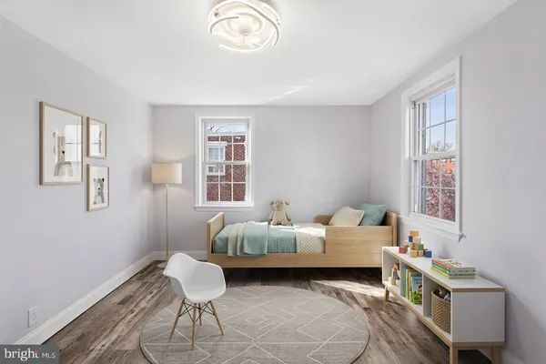 a bedroom with furniture and a window