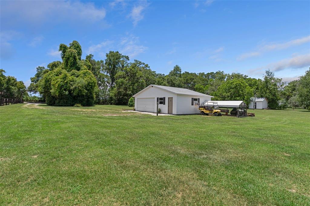 26255 Lambeth Road Brooksville, FL 34601 - Photo 60 of 76 a front view of a house with a garden